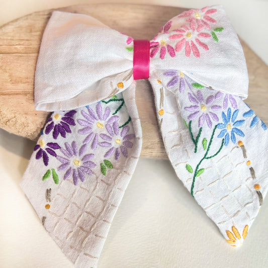 Embroidered Vintage Fabric Large Hair Bow with pink and purple and blue daisy flowers 
