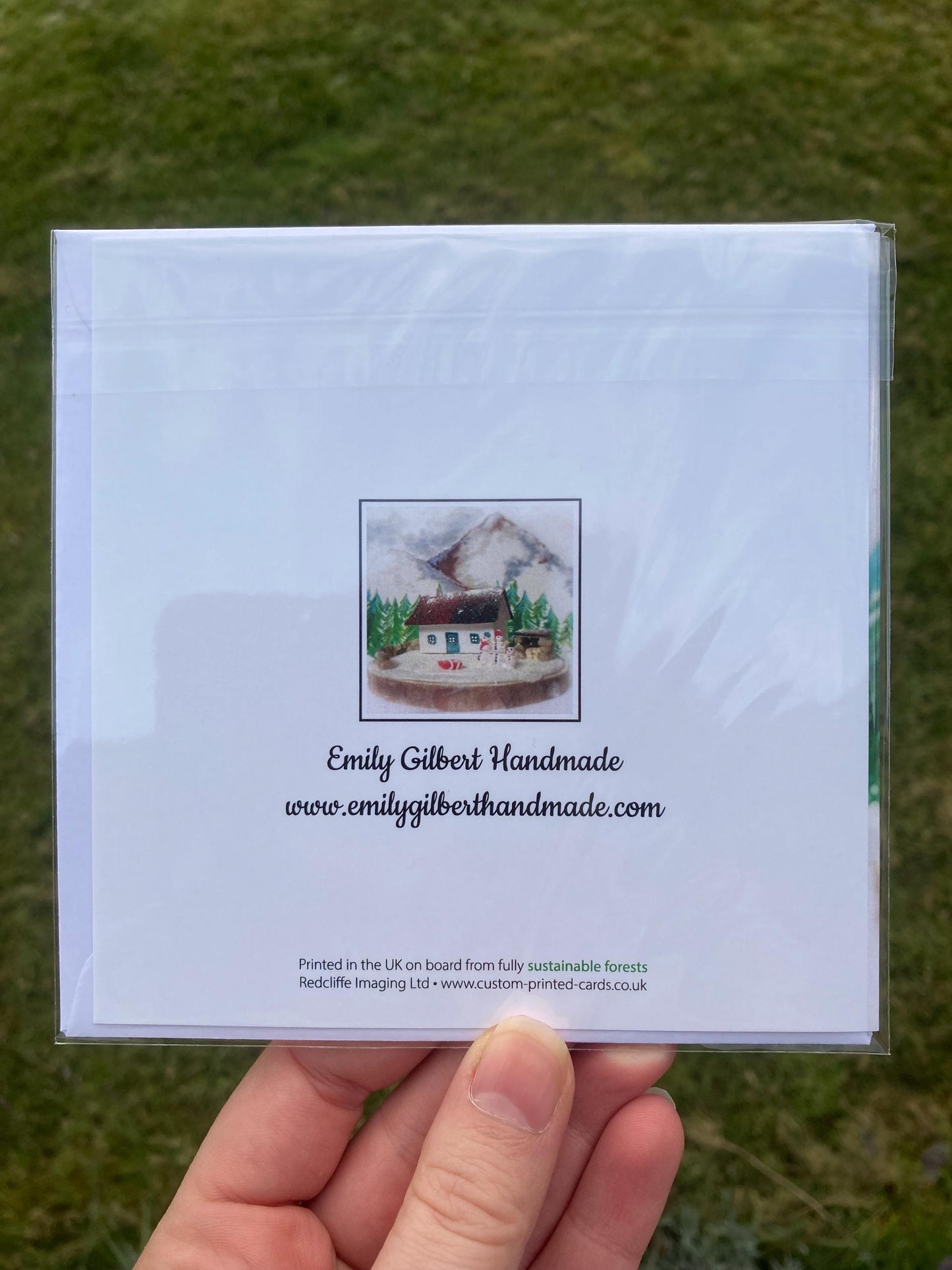 white back of winter bothy square greetings card with thumbnail of front image and website details underneath 