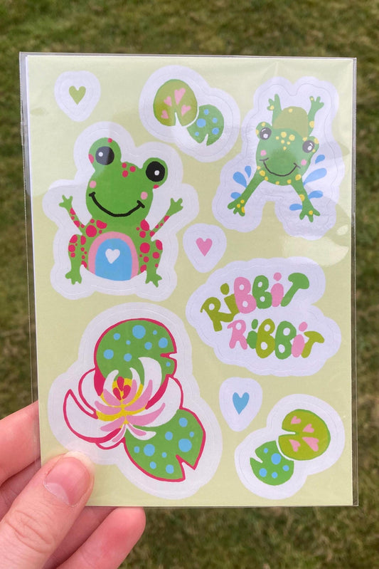 Green A6 size sticker sheet featuring cute cartoon frogs and lilypads