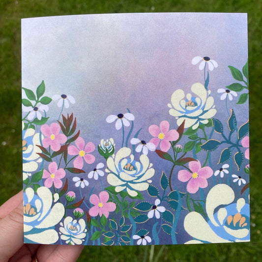 Square greetings card with ivory roses, large pink flowers and small white daises on a greyish pink misty background