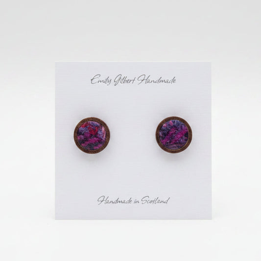 Purple round earrings on a 'Emily Gilbert Handmade' card held by a hand.